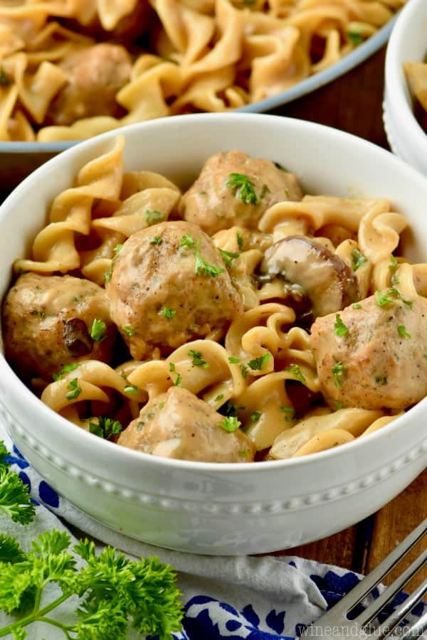 bowl of meatball stroganoff garnished with parsley