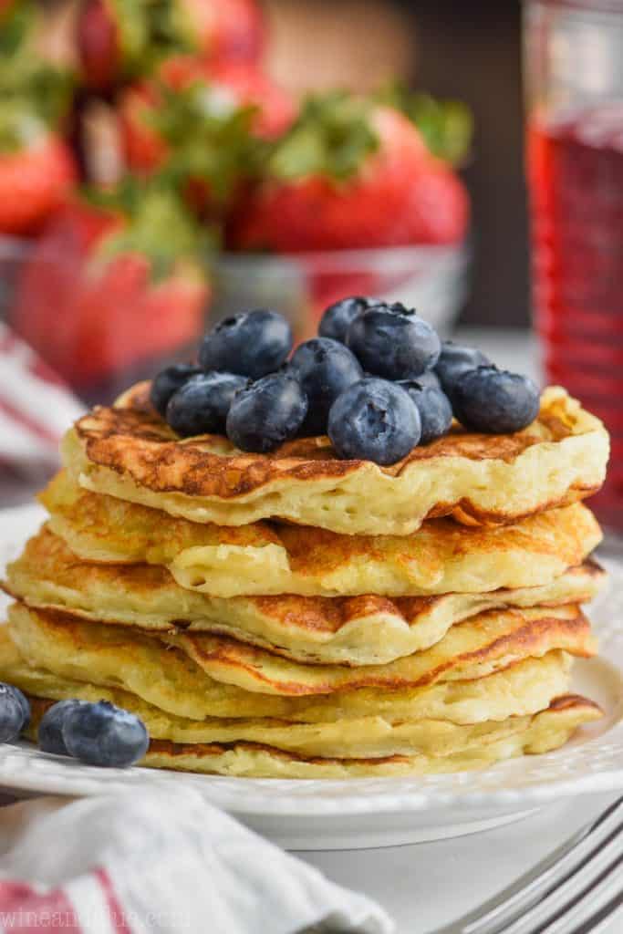 front close view of stack of yogurt pancakes topped with fresh blueberries