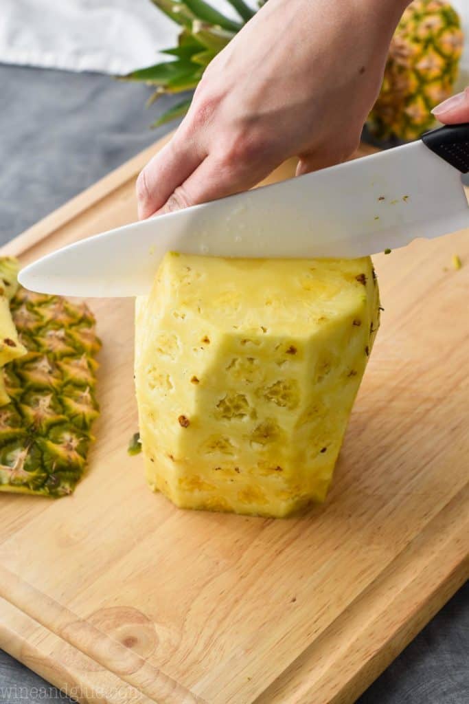 a pineapple being cut in half