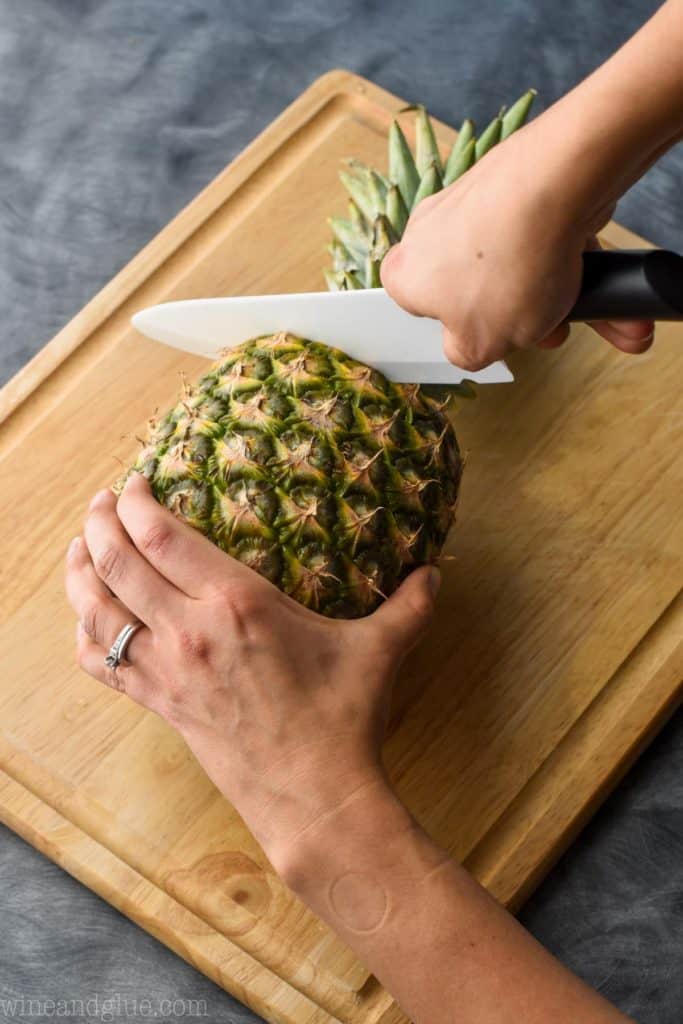 a pineapple with the top being cut off