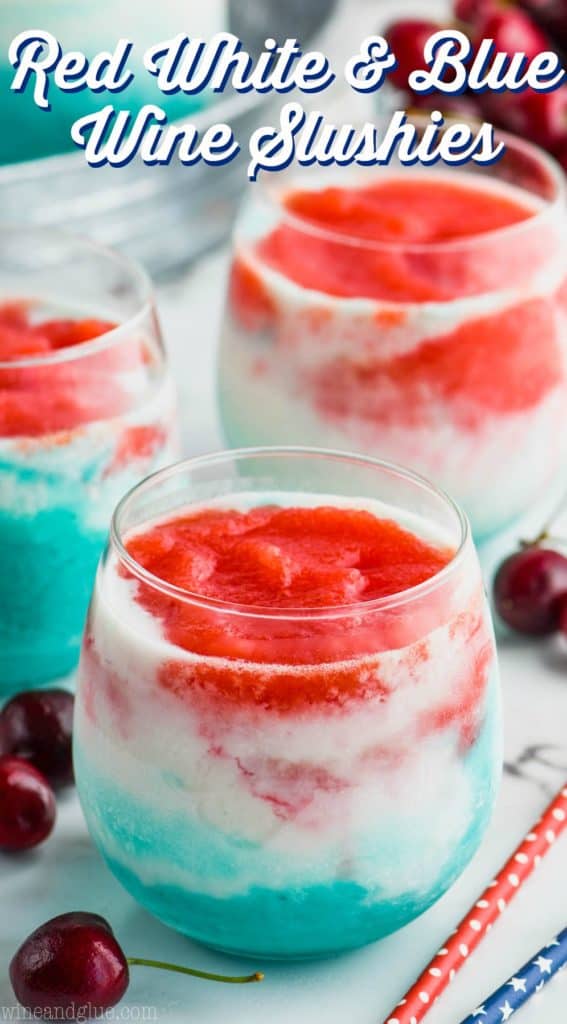 layered wine slushies with red, white, and blue for fourth of July cocktail
