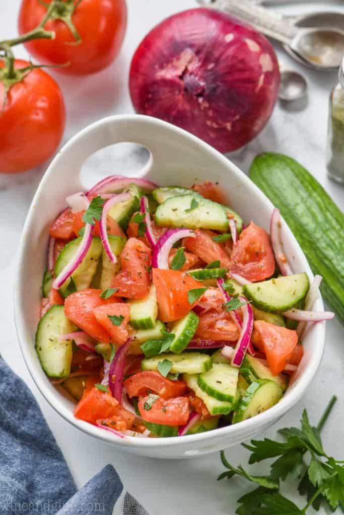 white bowl full of cucumber and tomato salad recipe