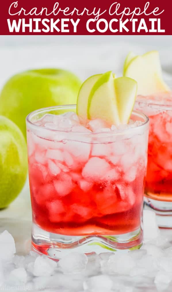 cranberry apple whiskey cocktail garnished with apple