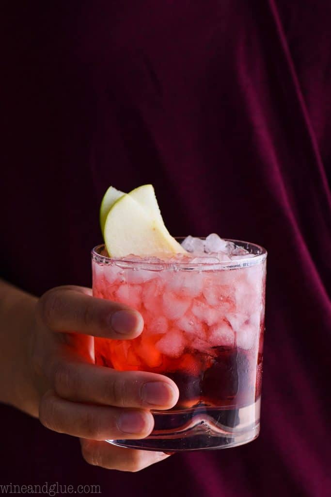 woman holding a glass of 