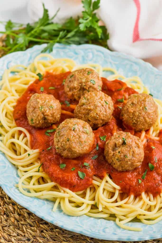 the best turkey meatball recipe on a bed of sauce and spaghetti