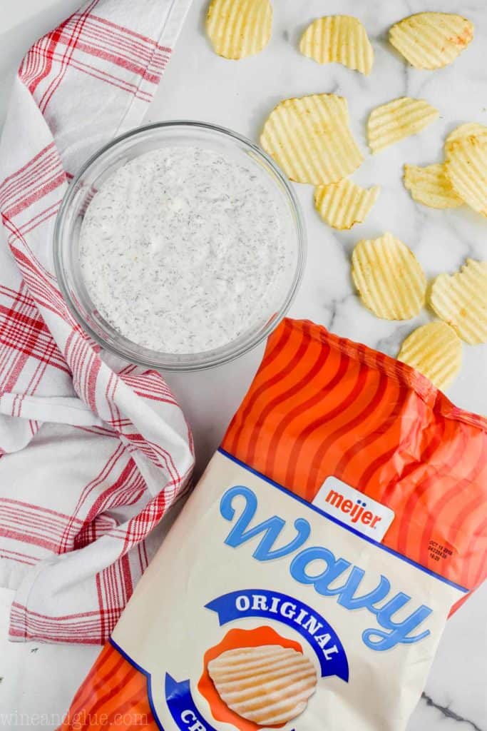 bowl of dill dip recipe sour cream with some wavy chips