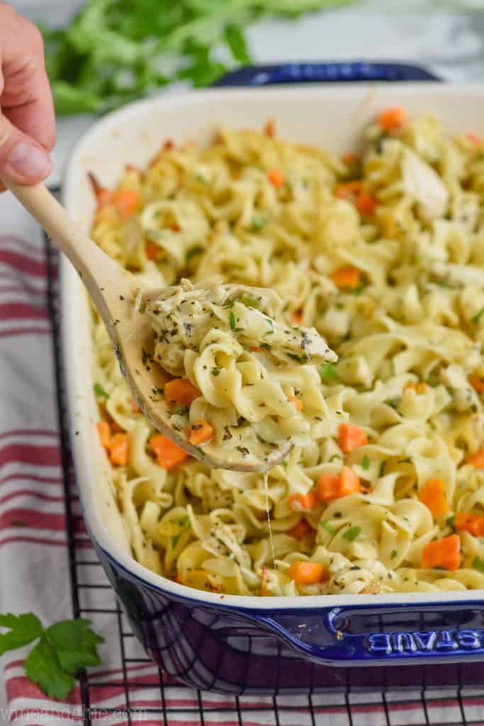spoon dishing out chicken noodle casserole recipe