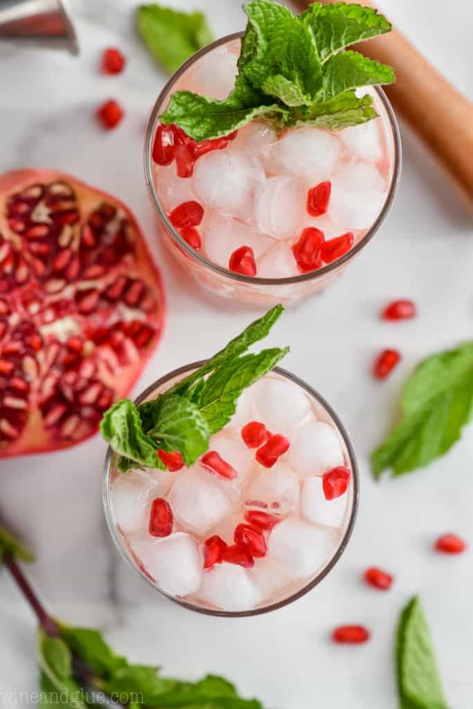 overhead view of two mojitos garnished with mint