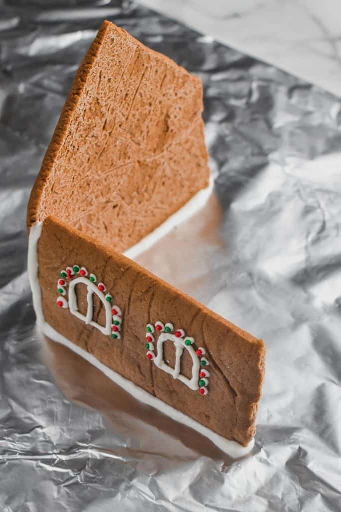 two pieces of gingerbread house standing up