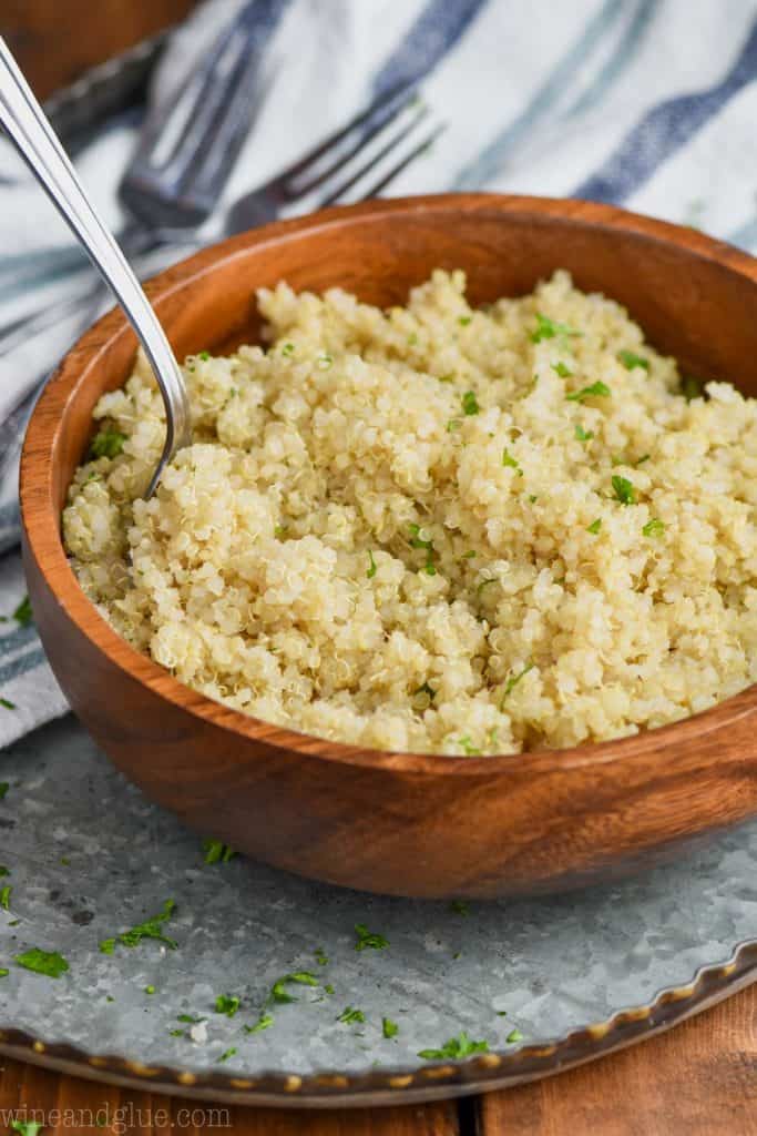 instant pot cooked quinoa in a small wooden bowl