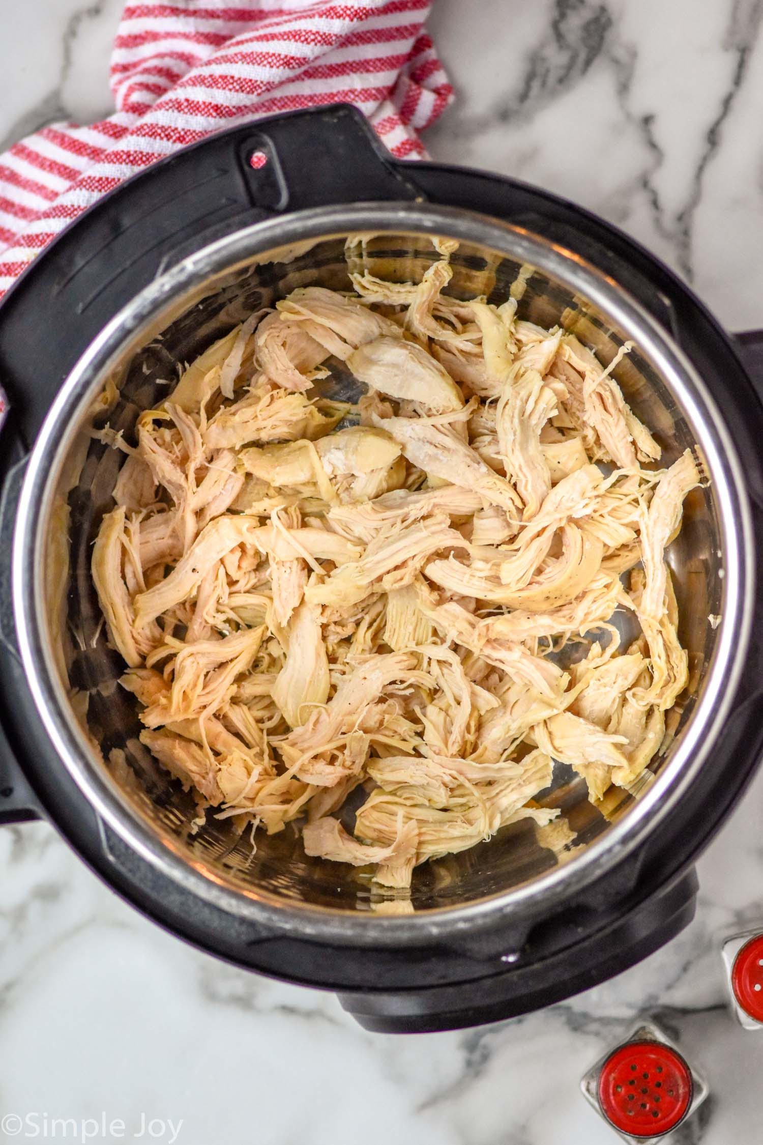 Overhead view of Instant Pot Chicken shredded in an instant pot