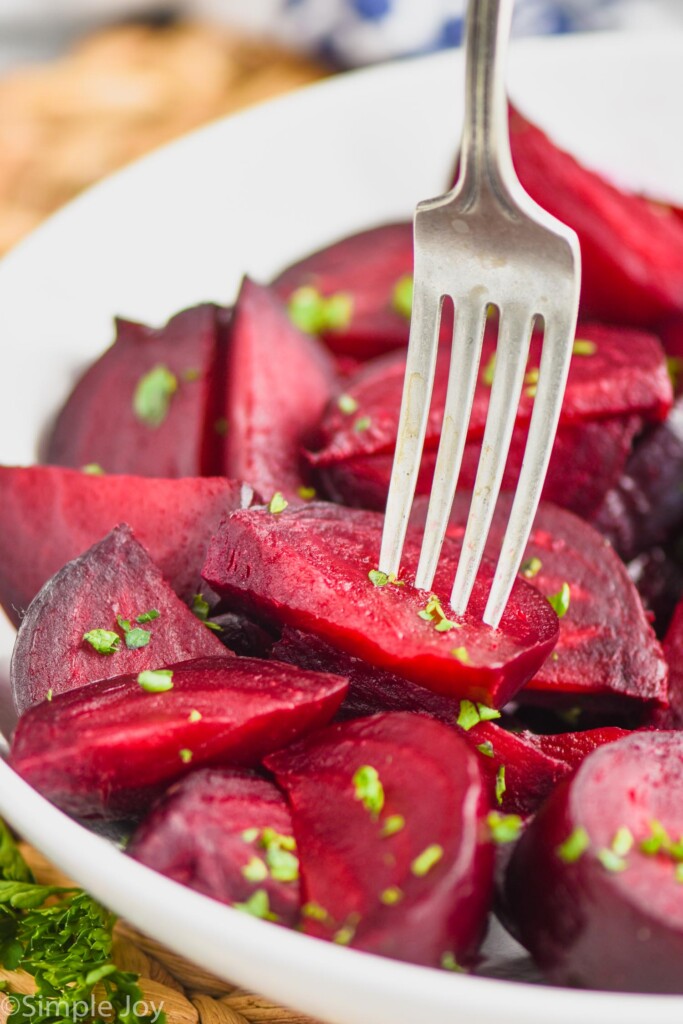 fork piercing a baked beet