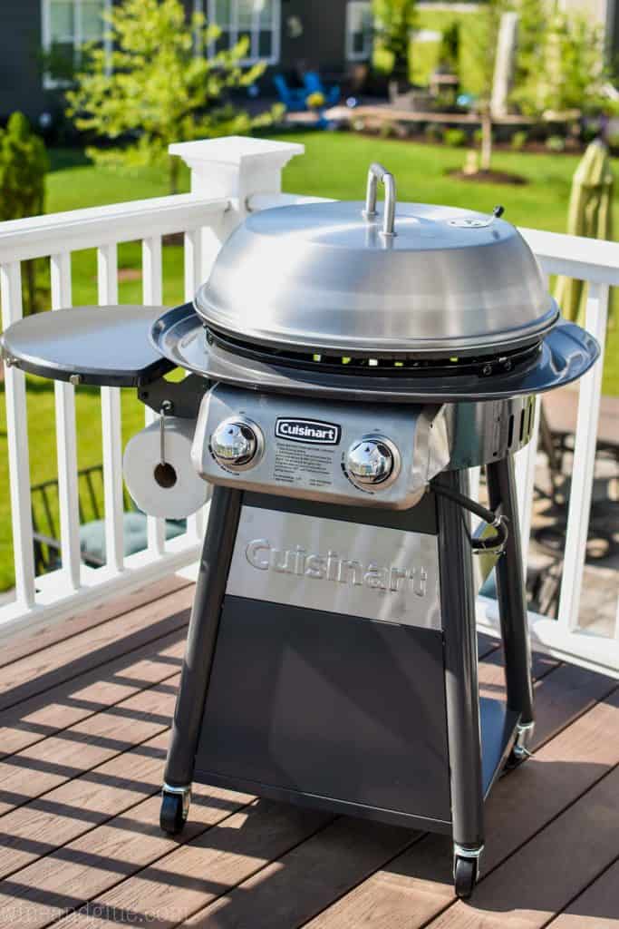 picture of Cuisinart 360 Griddle Cooking Center on a deck with a yard in the background