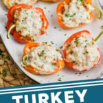 Pinterest graphic of six half peppers on a serving tray, says: turkey stuffed peppers simplejoy.com