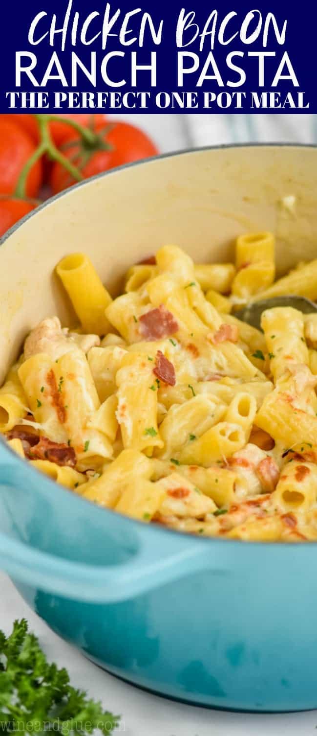 teal dutch oven filled with rigatoni noodles that have been baked with chicken and bacon for chicken bacon ranch pasta