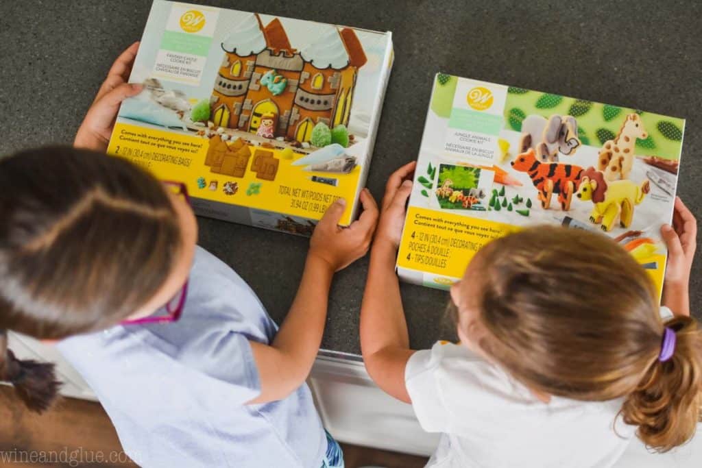 overhead view of two little girls holding cookie creation kits from Wilton