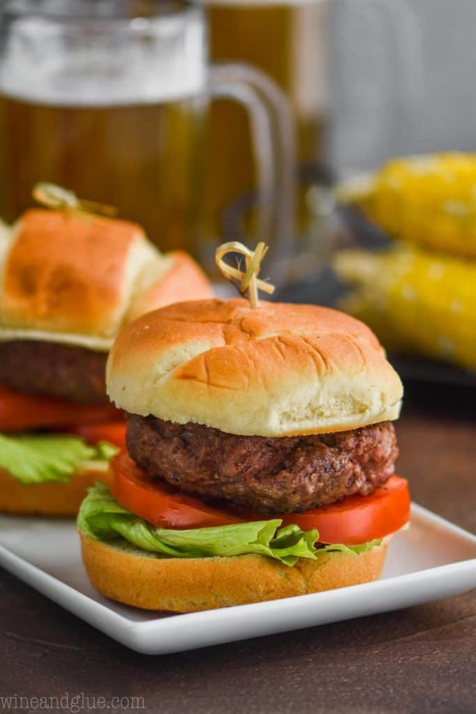 picture of a hamburger on a bun with lettuce and tomato 