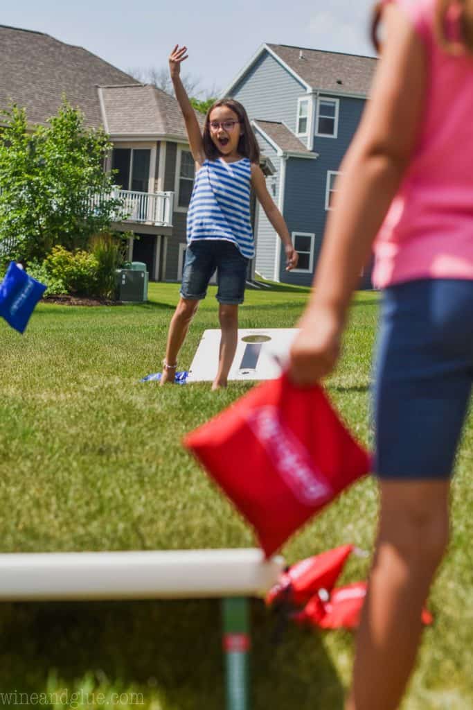 two little girls playing bags