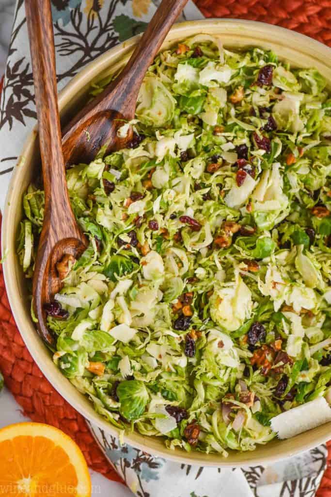 overhead view of shaved brussels sprouts salad recipe tossed with citrus dressing