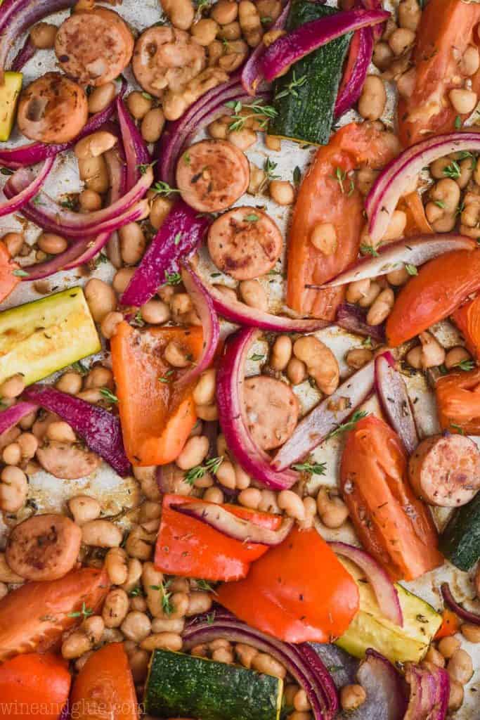 close up of a sheet pan sausage and vegetables that have been roasted