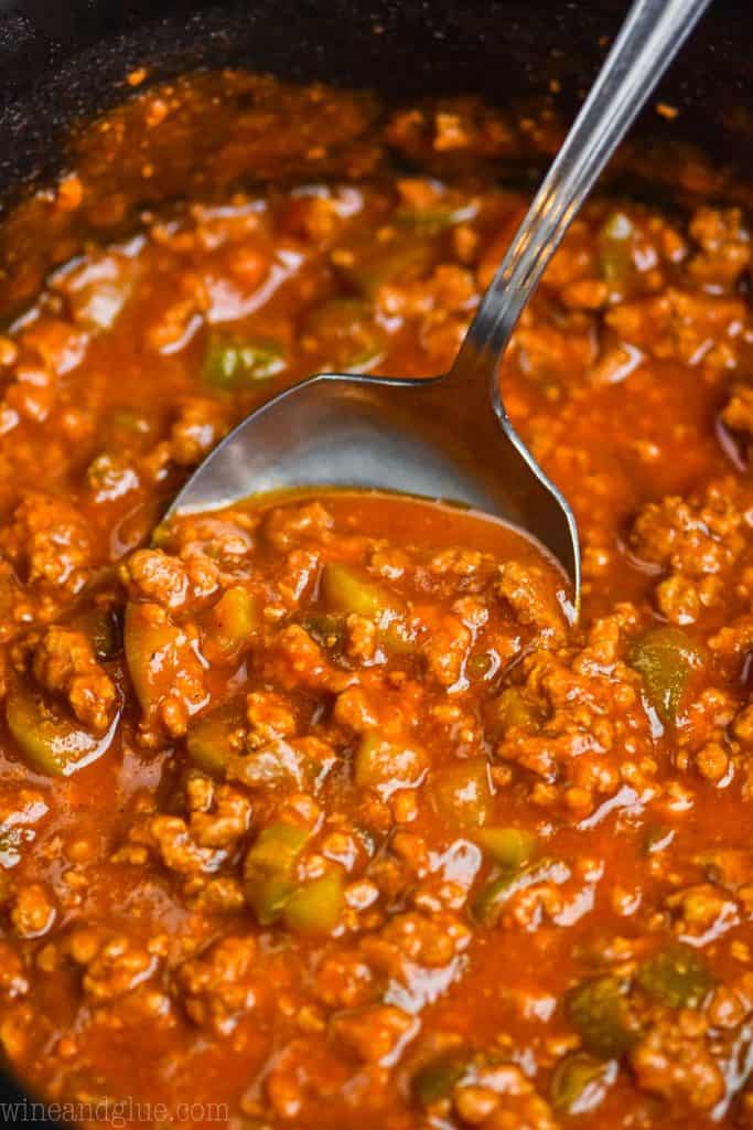 close up of a spoon dishing up sloppy joe crock pot recipe