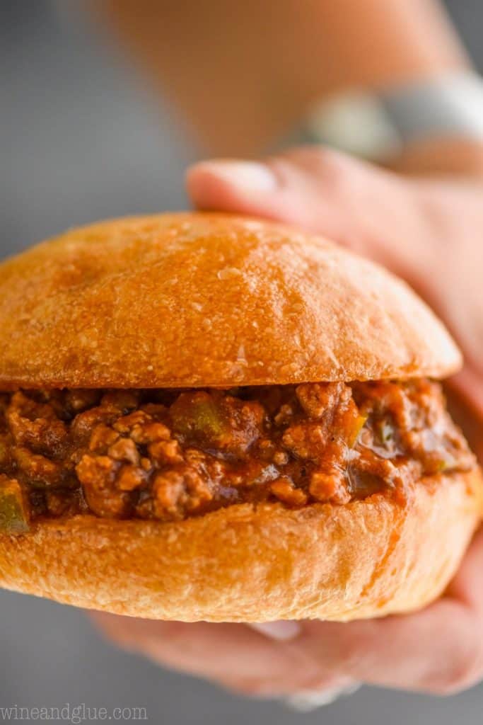 close up of a hand holding sloppy joe recipe