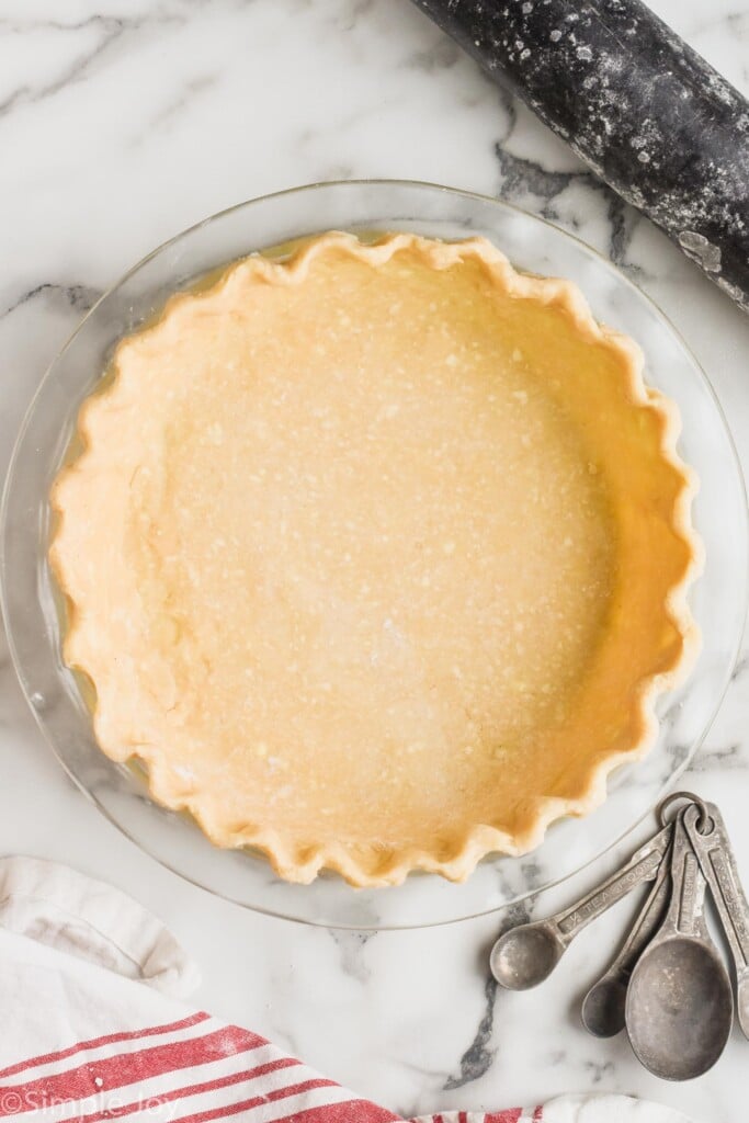 overhead of a raw pie crust recipe in a pie plate