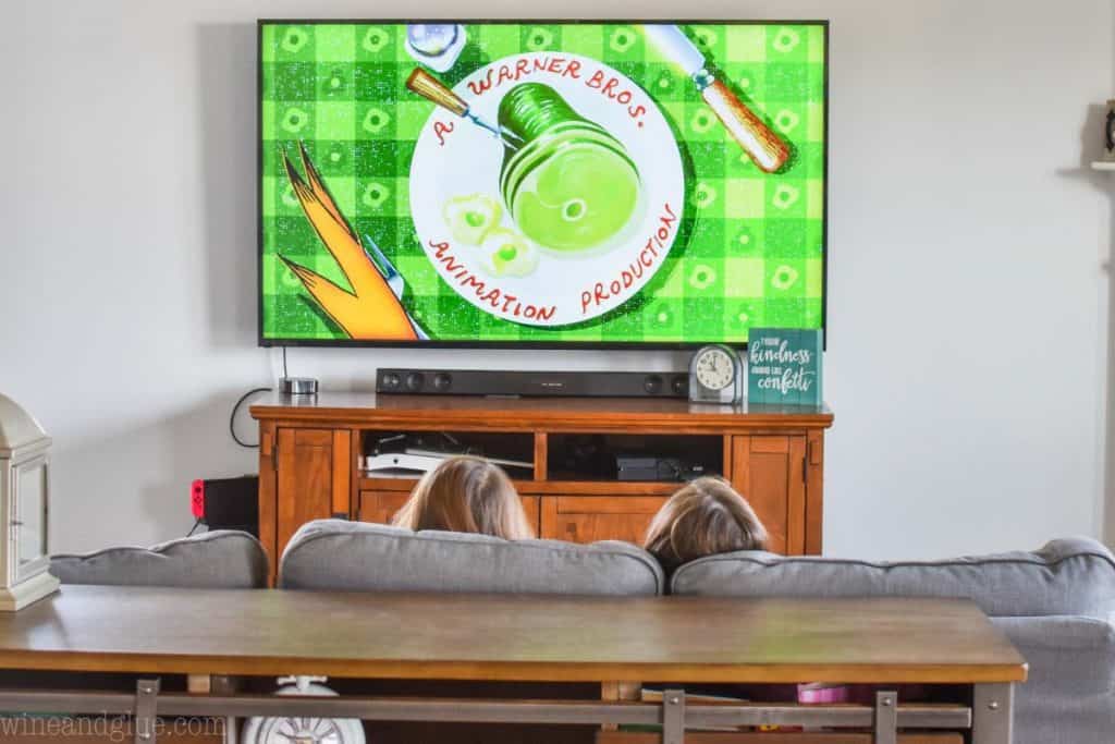 photo of the back of a couch with two little girls heads peeking out watching the Netflix show Green Eggs and Ham