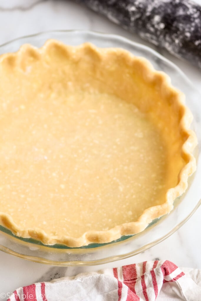 an unbaked homemade pie crust in a deep dish pie plate