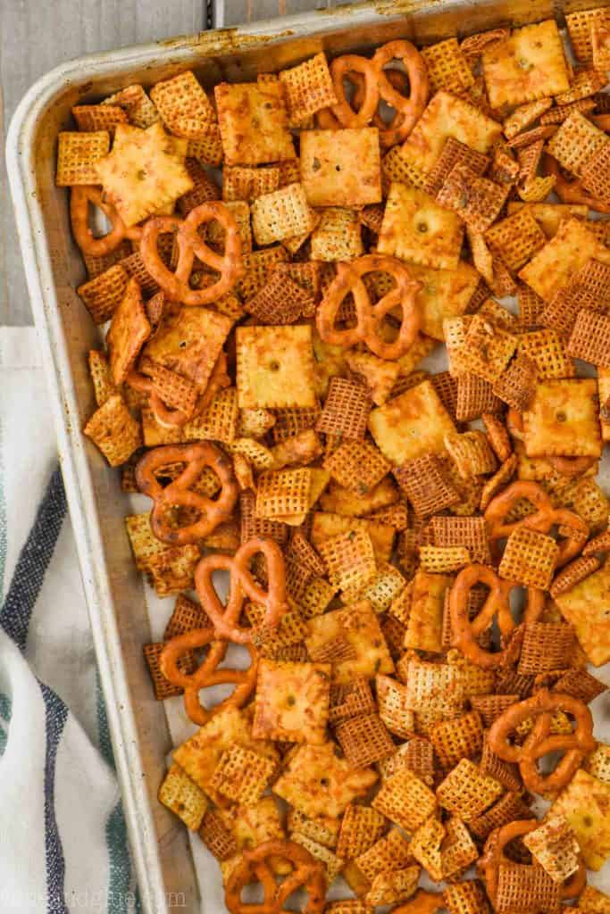 rimmed baking tray full of best chex mix recipe with pretzels, crackers, and cereal