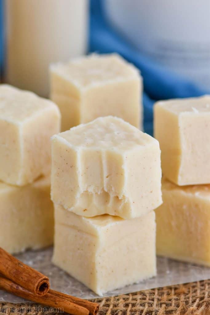 four stacks of rum Chata fudge, two pieces tall, the front one with a bite missing