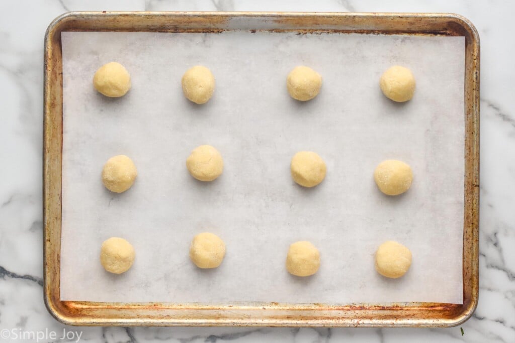 rolled sugar cookie dough on a baking sheet