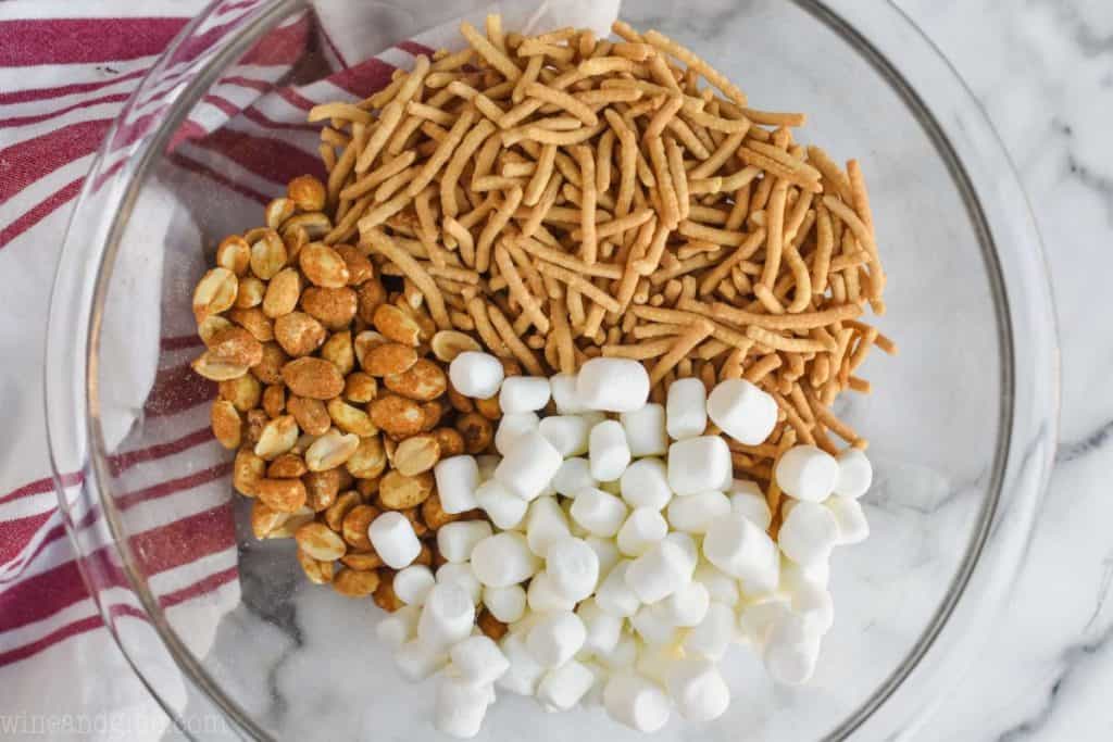 overhead view of bowl of peanuts, chow mien noodles, and marshmallows