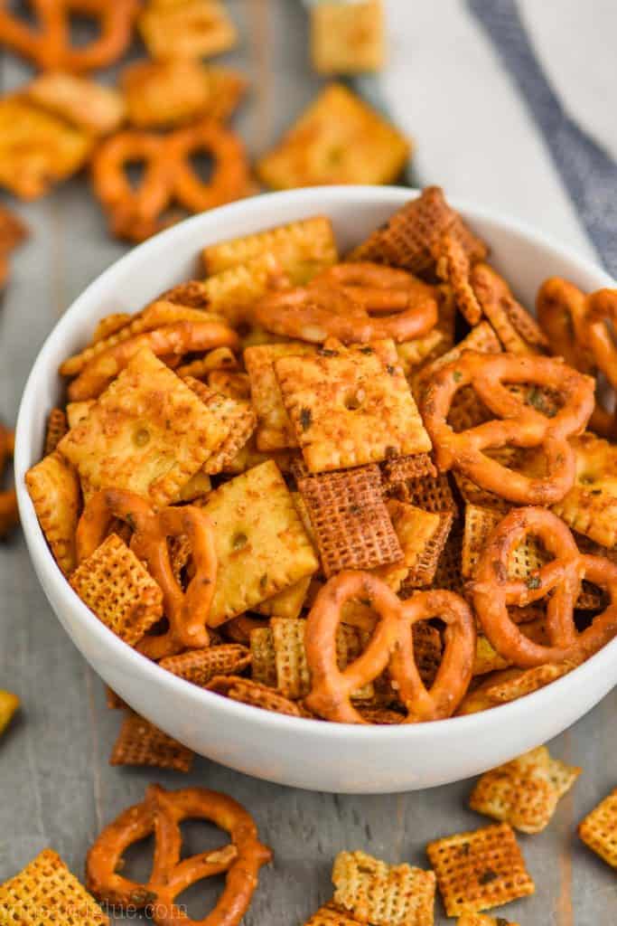 up close of a white bowl full of ranch chex mix