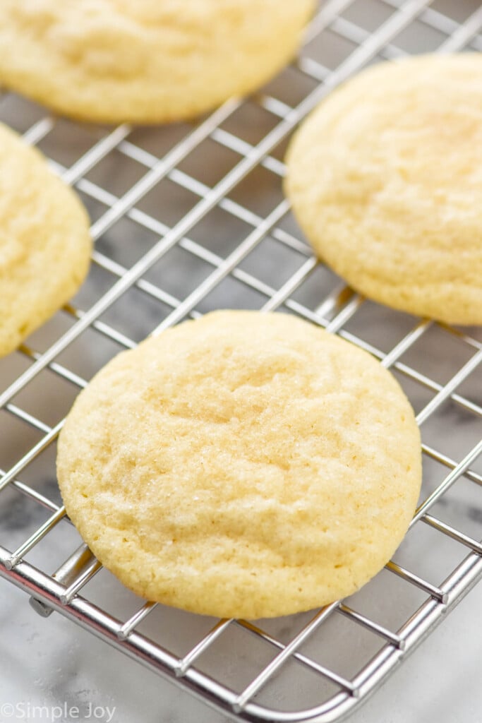 a sugar cookie sitting on a wire cooling rack