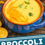 pinterest graphic of small blue ceramic soup bowl full of broccoli cheddar soup garnished with more cheese and round orange crackers next to the bowl, says: "broccoli cheddar soup, simplejoy.com"