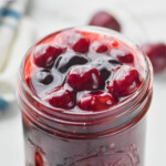 pinterest graphic of small mason jar of cherry pie filling, says: the best cherry pie filling simplejoy.com