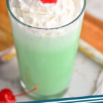 pinterest graphic of a tall glass of shamrock shake with whipped cream and a cherry, says: shamrock shake simplejoy.com