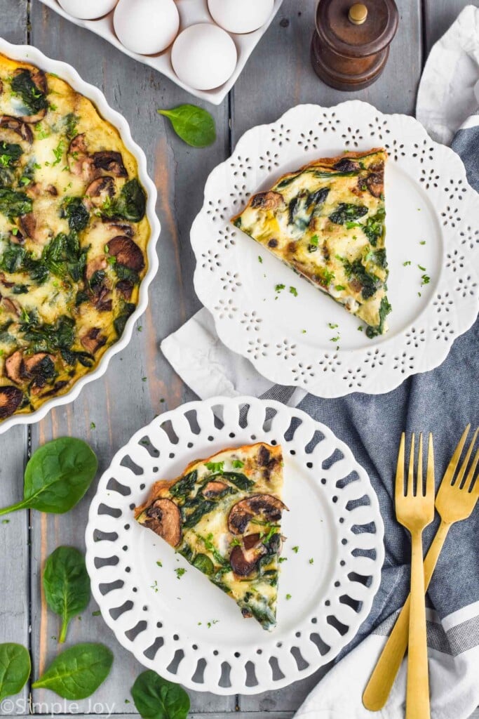 overhead view of two pieces of easy spinach quiche on white plates