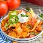 walking taco casserole recipe on two small white plates