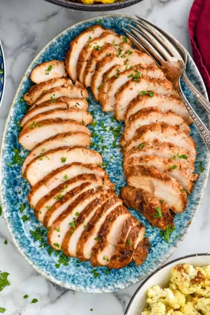 turkey tenderloin sliced and on a platter