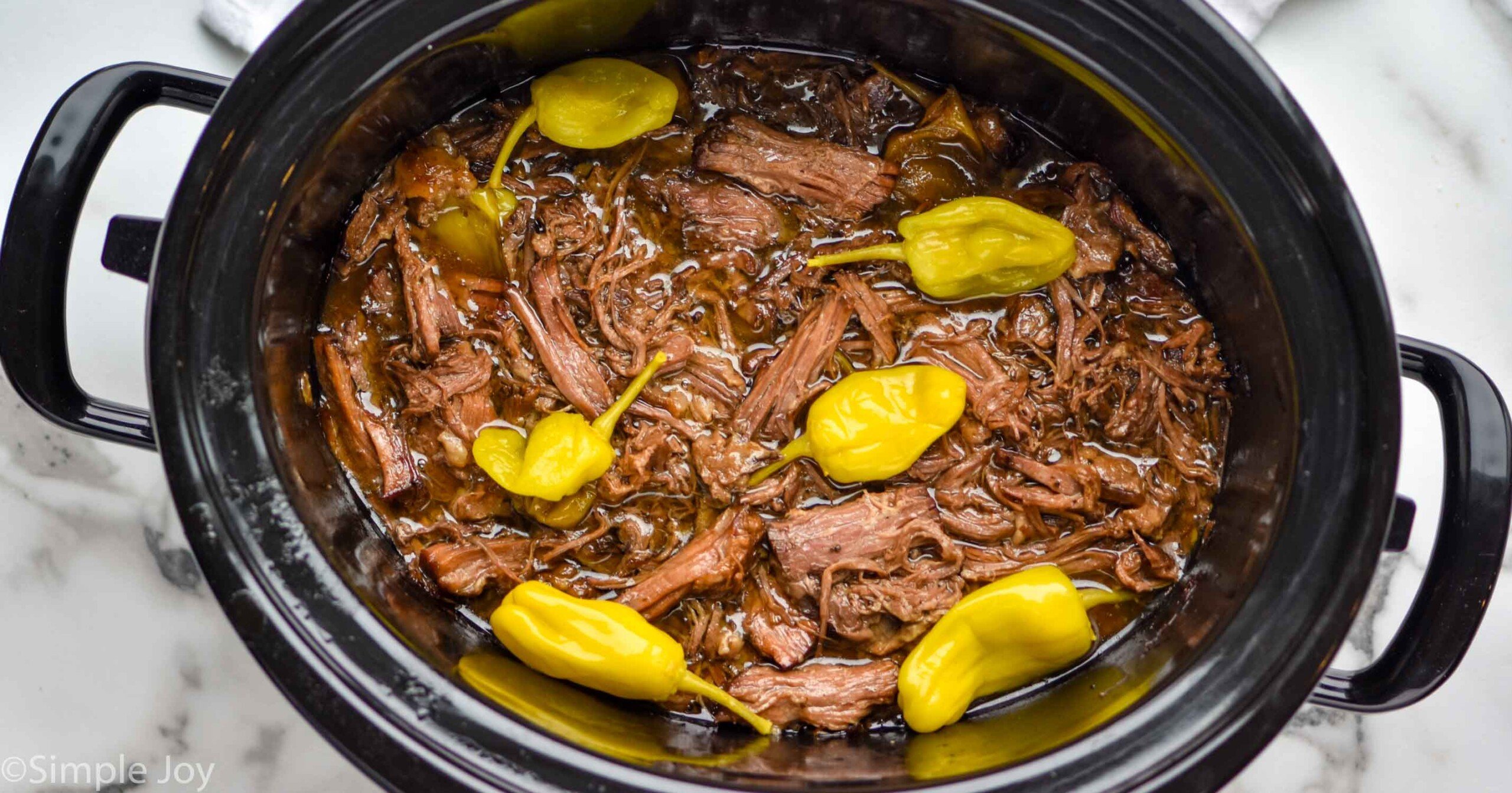 https://www.simplejoy.com/wp-content/uploads/2022/02/mississippi-pot-roast-social-share-scaled.jpg