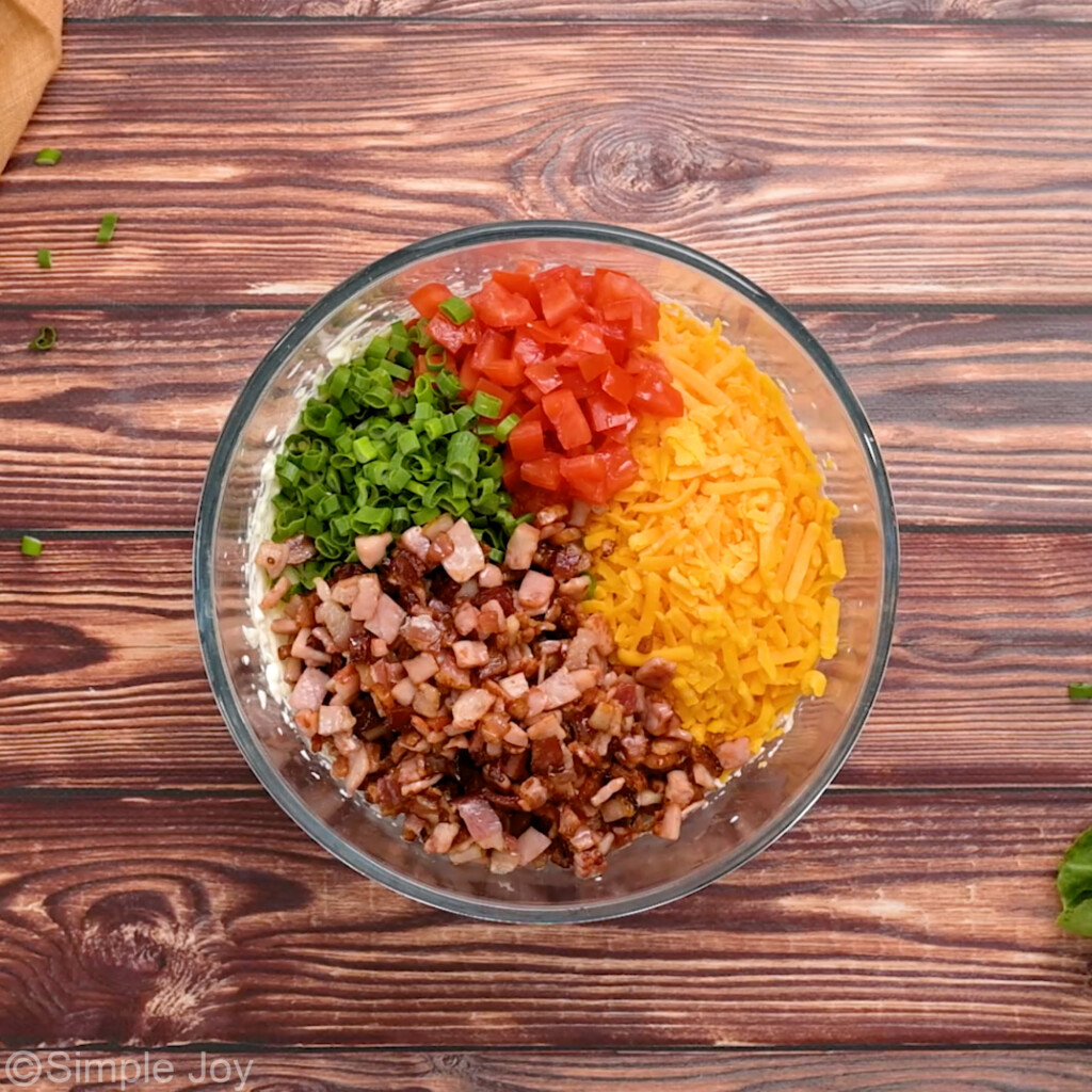 overhead of ingredients for blt dip in a bowl