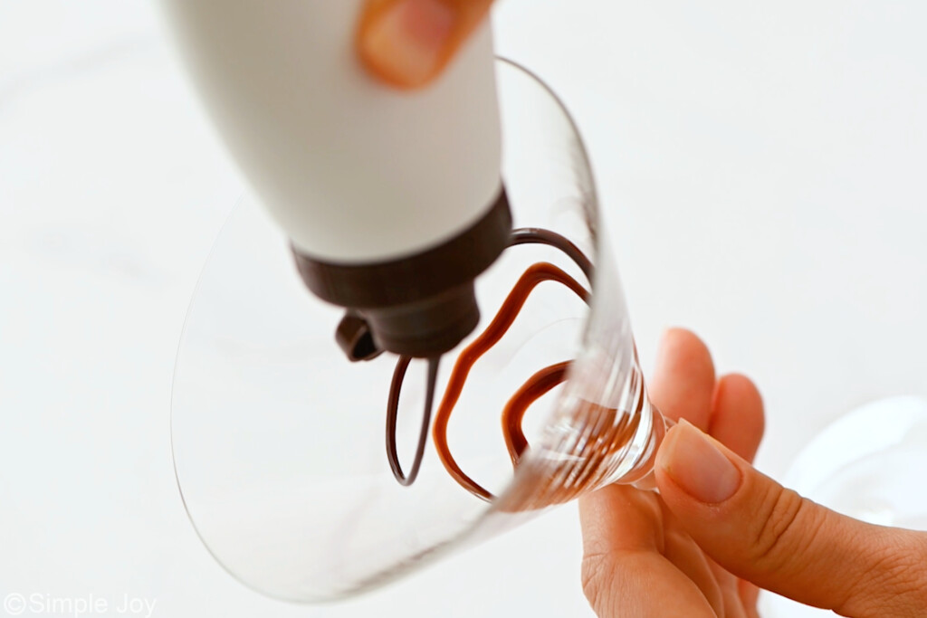 drizzling chocolate in a martini glass