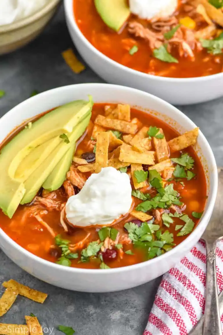 Bowl of Chicken Tortilla Soup garnished with avocado and sour cream