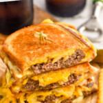 Pinterest graphic for Patty Melt. Text says "amazing Patty Melt recipe simplejoy.com" Image shows a patty melt with french fries beside.