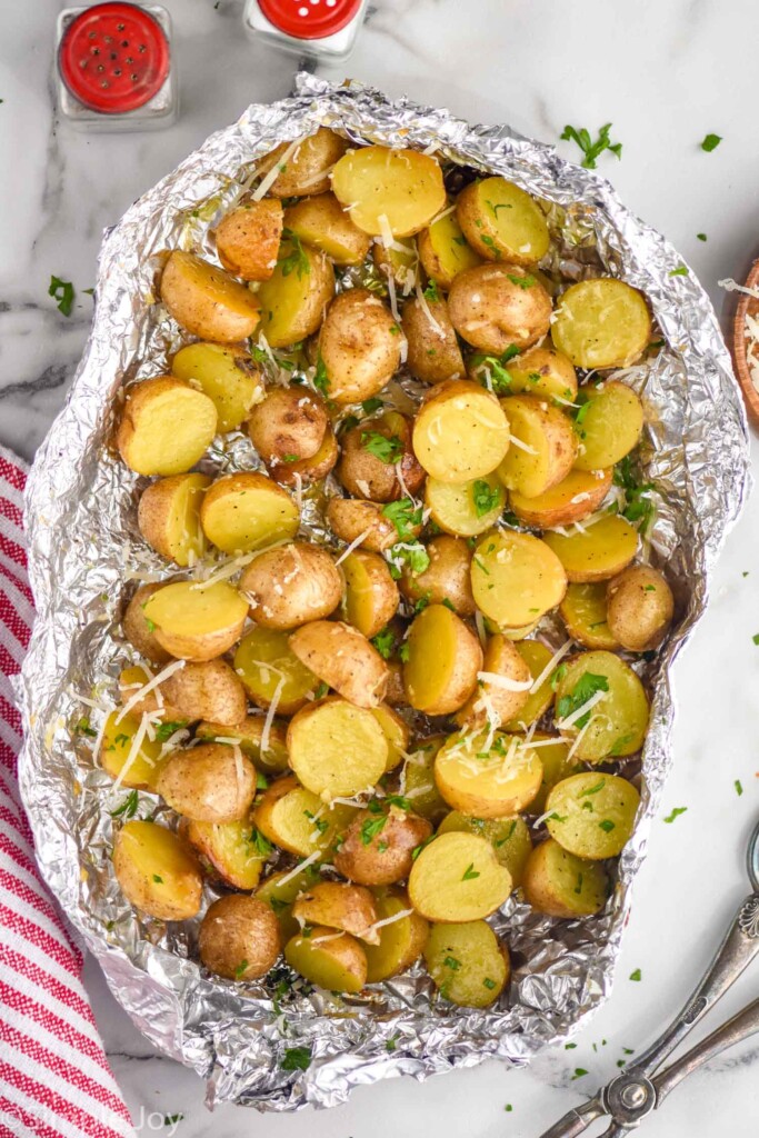 overhead of grilled potatoes in foil