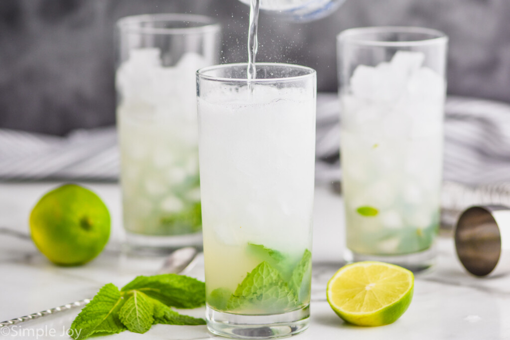 topping a mojito with club soda