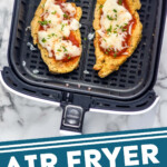 Pinterest graphic for Air Fryer Chicken Parmesan. Image shows overhead of air fryer basket with two pieces of Air Fryer Chicken Parmesan. Text says "Air Fryer Chicken Parmesan simplejoy.com"