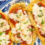 Pinterest graphic for Air Fryer Chicken Parmesan. Text says "Air Fryer Chicken Parmesan simplejoy.com" Image shows pieces of Air Fryer Chicken Parmesan on a plate